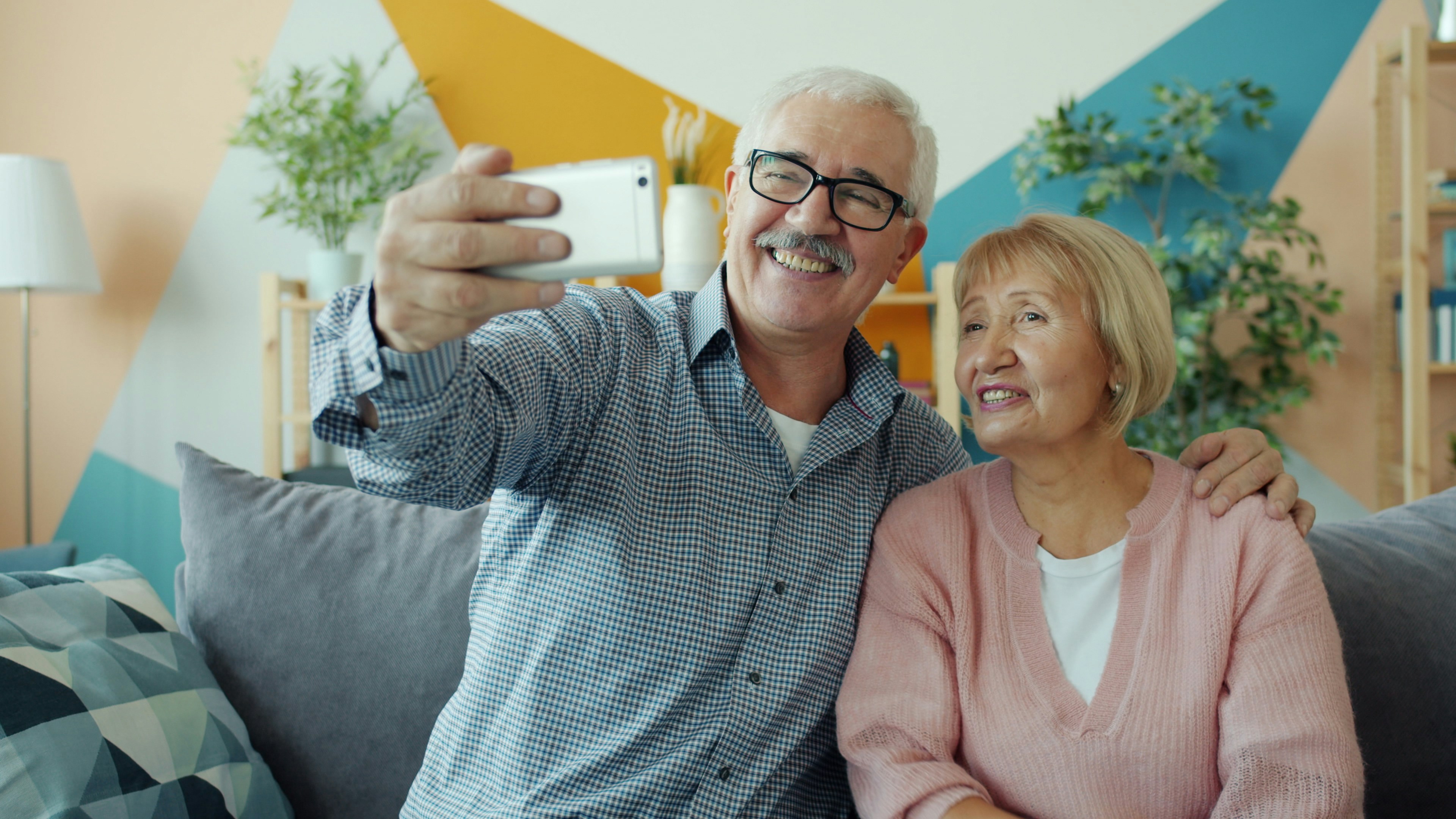 Two mature adults laughing and sharing a joyful moment together